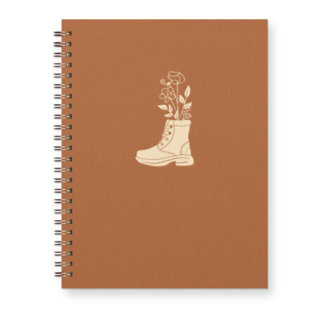 Letterpress journal for nature-lovers that features a hiking boot with a hand-drawn floral bouquet