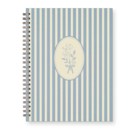 Spiral bound light blue journal with a striped pattern and hand drawn floral design.